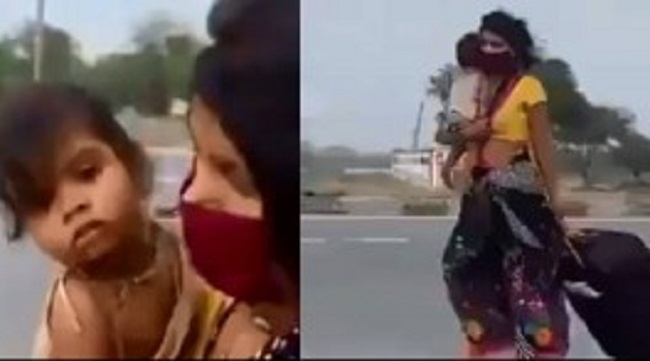 ஒரு கையில் குழந்தை… கொரோனாவால் பரிதாபமாக நடந்து செல்லும் பெண்ணின் காட்சி!