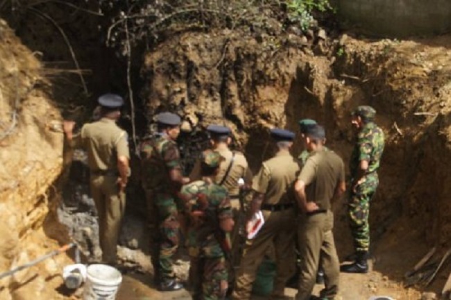 கைதான பொலிஸ் அதிகாரியின் வீட்டுத் தோட்டத்தில் பொலிஸார் கண்ட காட்சி!  அதிர்ச்சியில் பொலிஸார்!