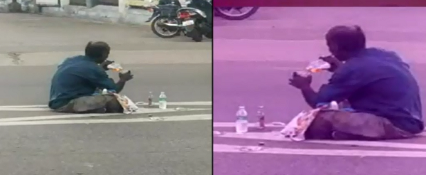 நடுரோட்டையே பாராக நினைத்து ஹாயாக அமர்ந்தபடி ஒருவர் மது அருந்திய காட்சி!